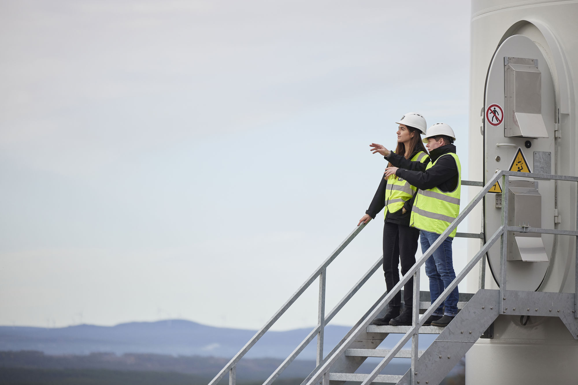 Two people at the entrance to a wind mill